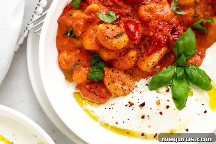 Gnocchi burrata in serving bowl, showcasing its creamy goodness.