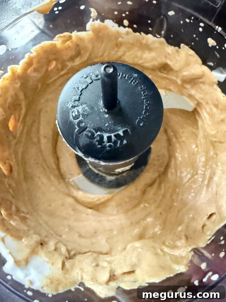 Sauce ingredients blended smoothly in a food processor.