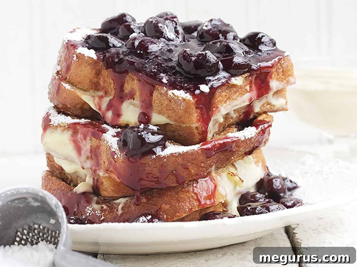 Stacked Cherry French Toast with Vanilla Cream and Cherry Sauce
