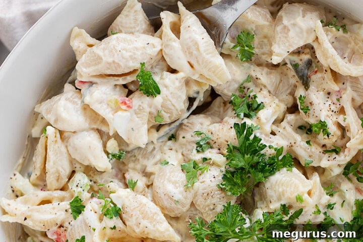 Shell pasta salad in a serving bowl.