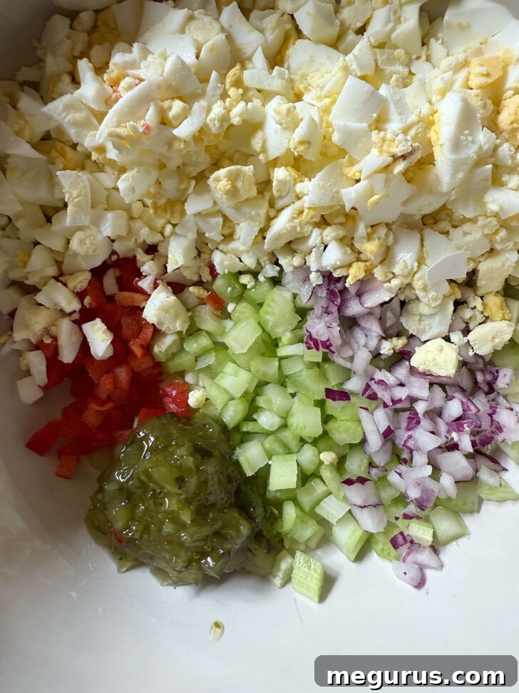 Sweet green relish being spooned into the large salad bowl.