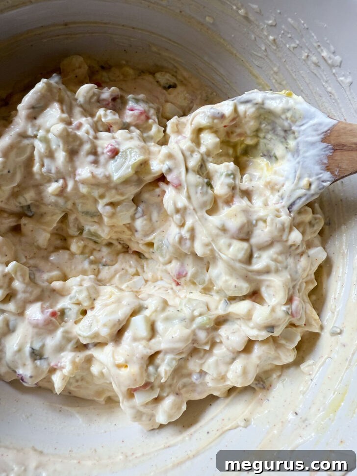 All salad ingredients (except pasta) mixed thoroughly in the large bowl.