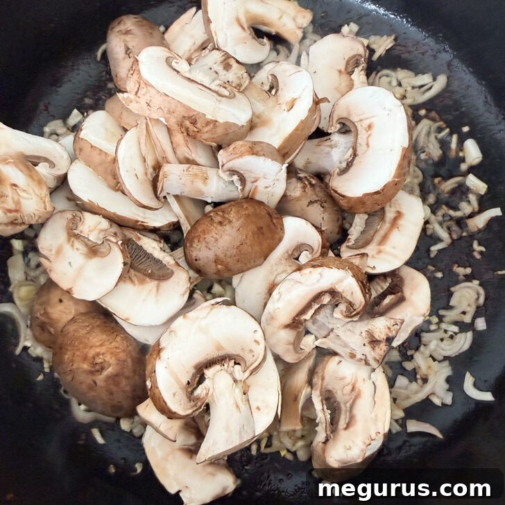 Shallots and mushrooms gently sizzling in a skillet, their aroma filling the kitchen as they soften and turn golden.