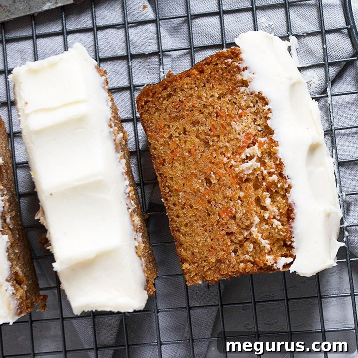Carrot Cake Loaf with Cream Cheese Frosting, beautifully sliced.