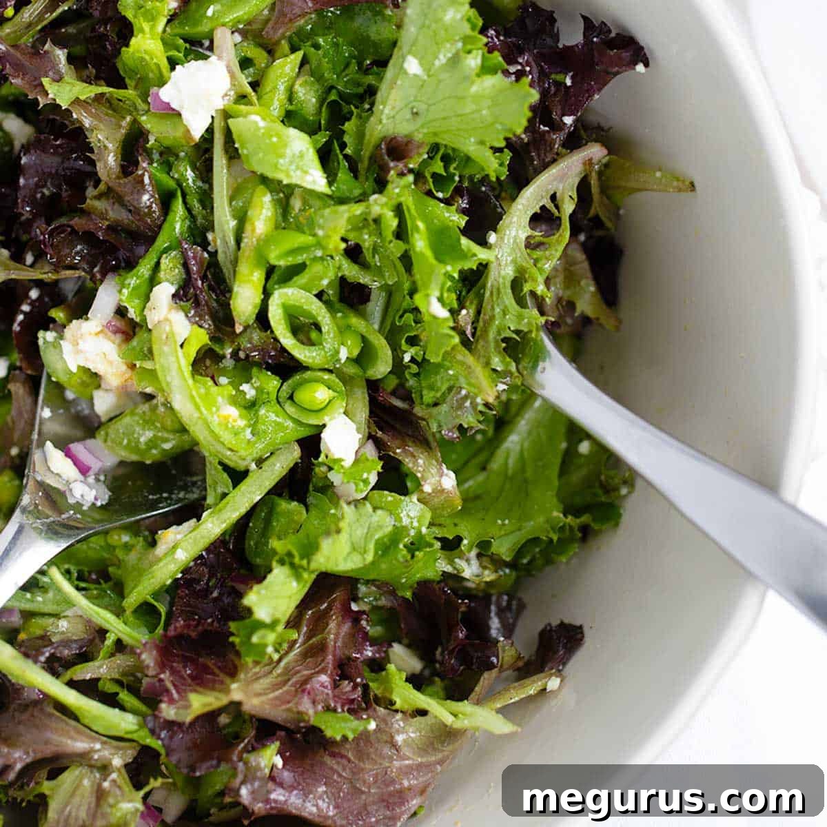 Chopped Spring Salad with asparagus and snap peas in a bowl, fresh and vibrant.