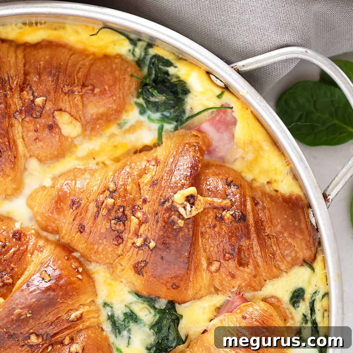 Ham and Cheese Croissant Bake in a pan, golden and puffed.