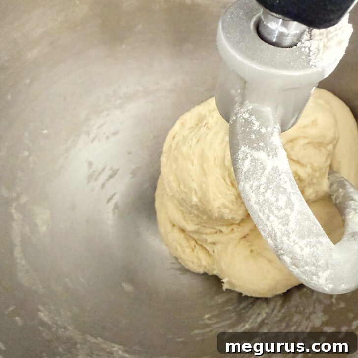 The smooth, elastic dough rests in a mixing bowl after being kneaded.