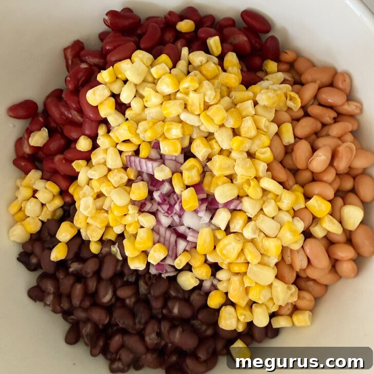 Rinsed beans and corn in a large bowl.