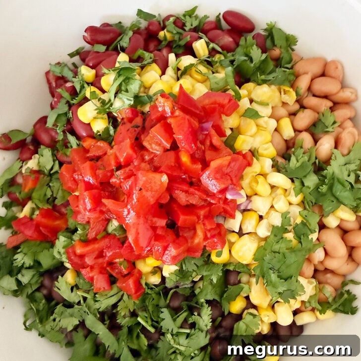 Roasted red peppers added to the salad bowl.