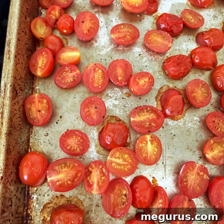 Orecchiette Pasta Salad with Crispy Halloumi and Lemon Dressing 3 Oven-roasted cherry tomatoes on a baking sheet.