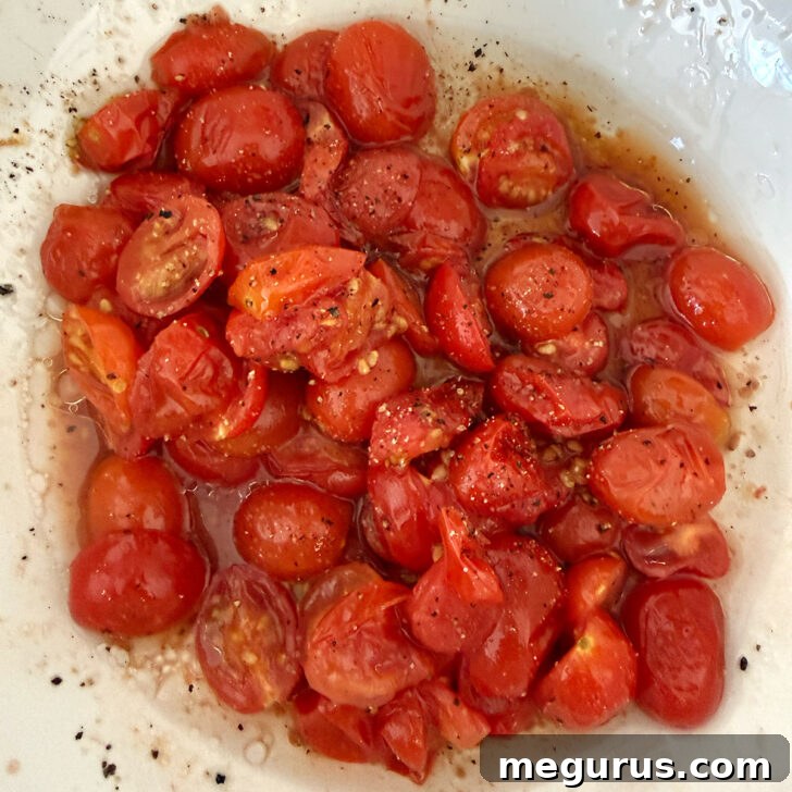 Orecchiette Pasta Salad with Crispy Halloumi and Lemon Dressing 4 Roasted tomatoes in a bowl with oil and vinegar.