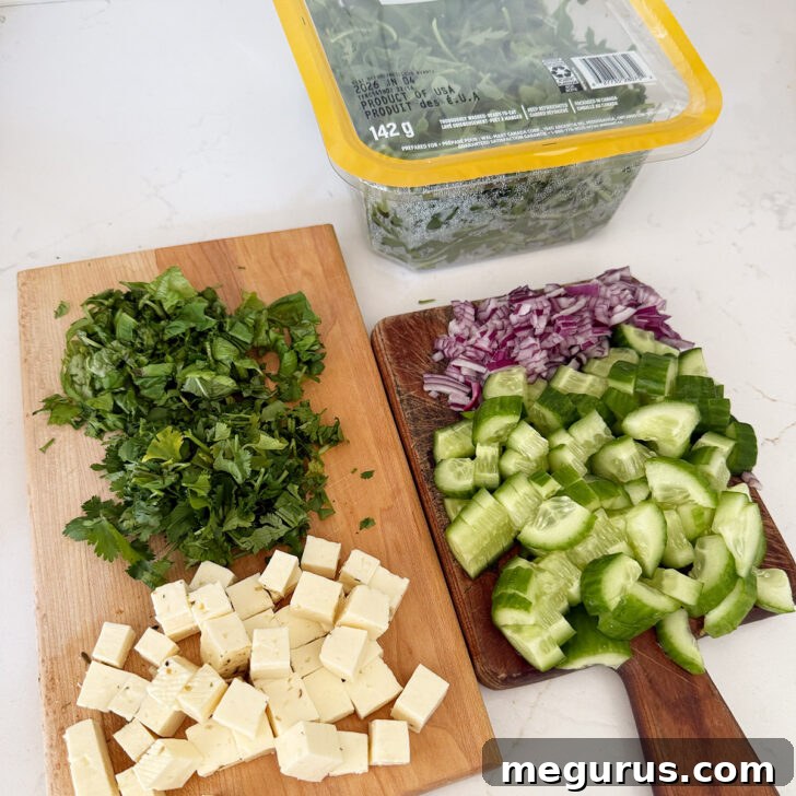 Orecchiette Pasta Salad with Crispy Halloumi and Lemon Dressing 7 Vegetables, herbs, halloumi and arugula prepared.